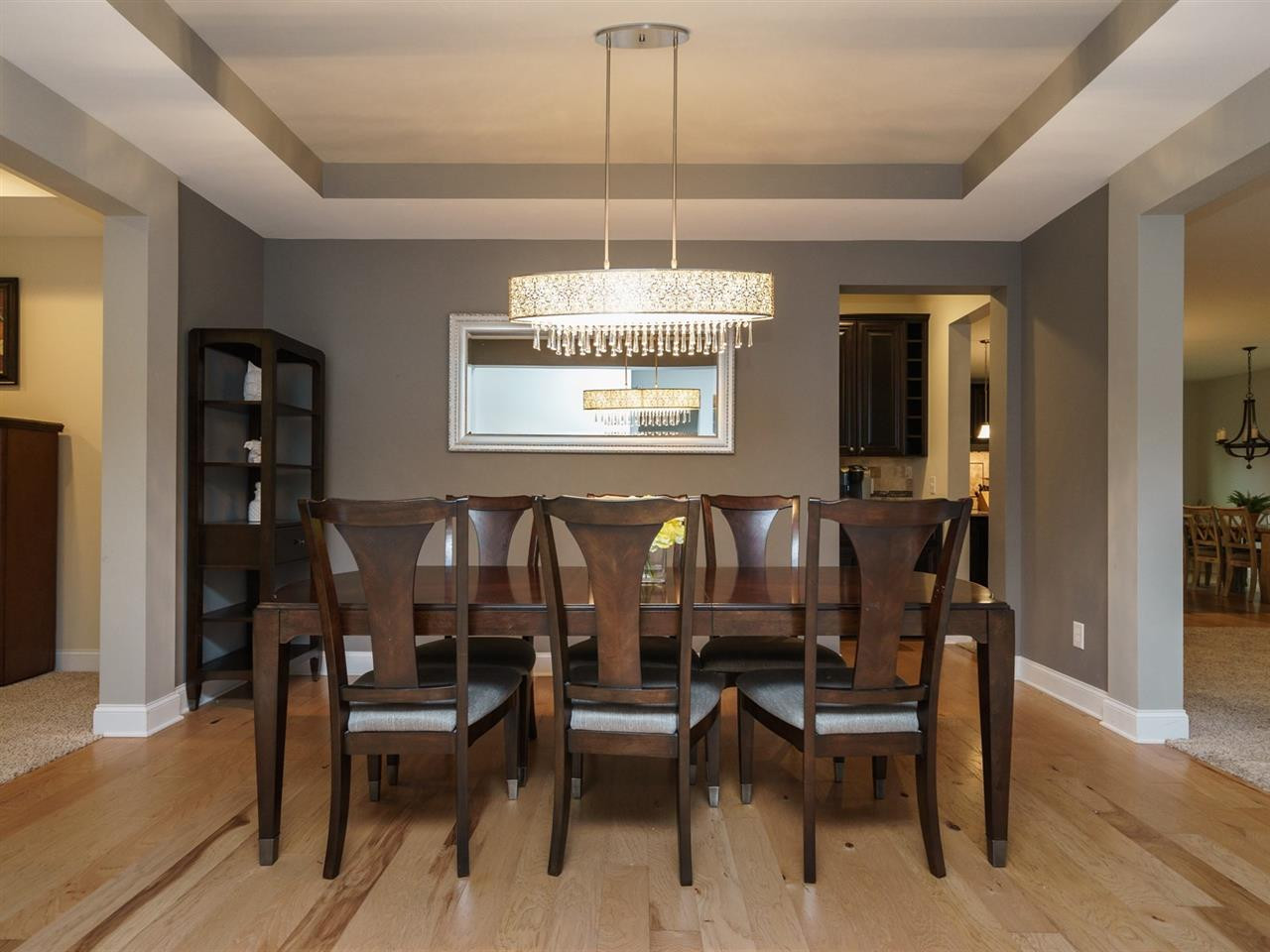 Imagine hosting holiday parties or family celebrations in this elegant space. The trey ceiling and beautiful chandelier complete the package. Dining Room
