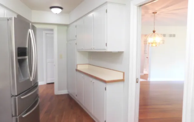 a kitchen with stainless steel appliances a refrigerator and a stove