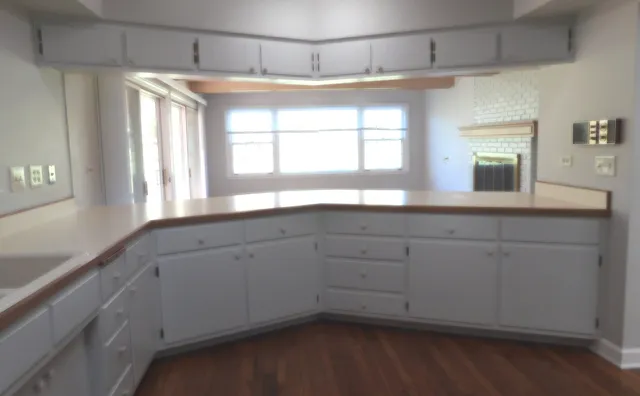 a bathroom with a sink and a large mirror