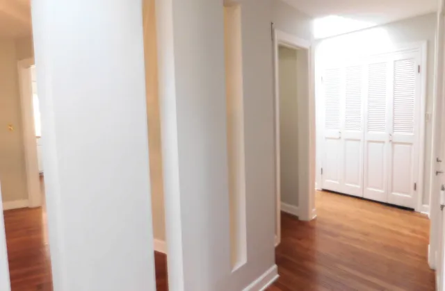 a view of a livingroom with wooden floor