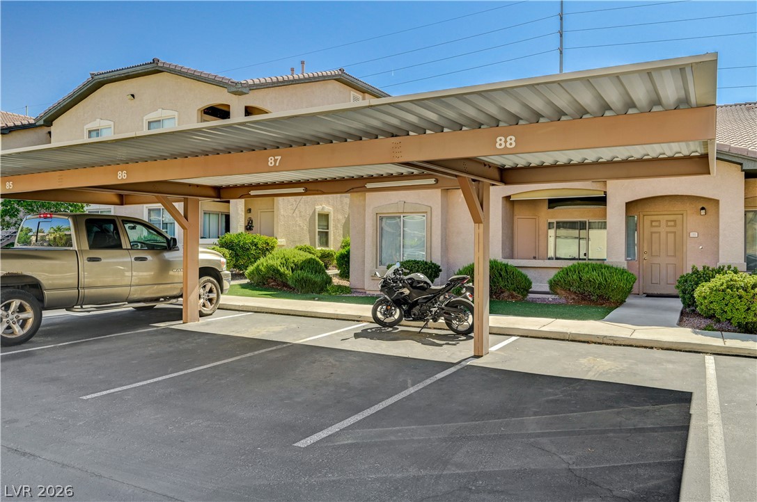 8985 South Durango Drive, Unit 2187 Las Vegas, NV 89113 - Photo 24 of 73 Secure covered parking with dedicated spaces ensures convenience for residents.