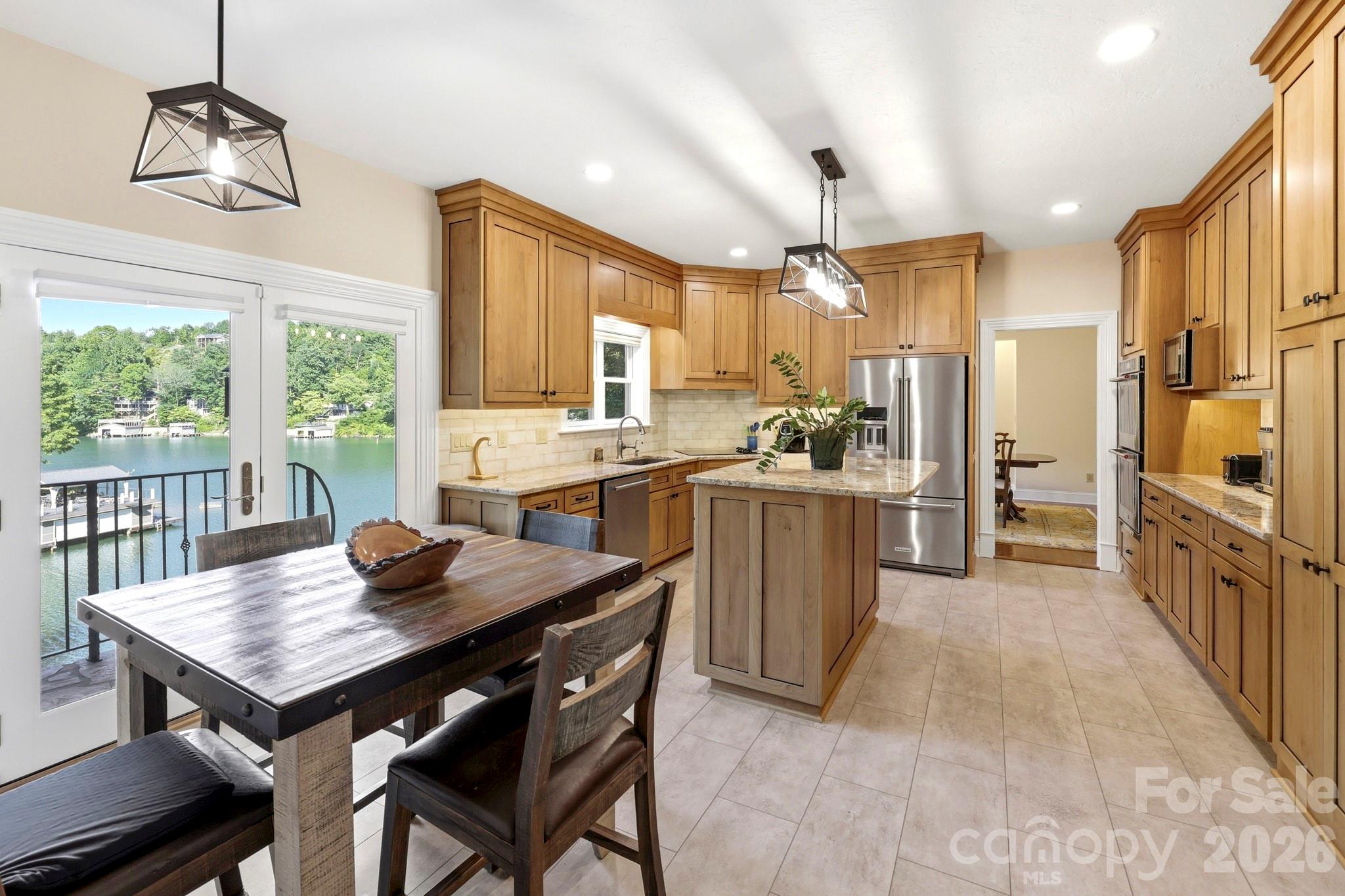 151 Garner Road Lake Lure, NC 28746 - Photo 13 of 48 a kitchen with sink cabinets and wooden floor