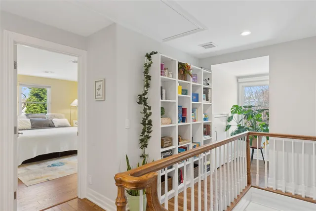 a bathroom with a sink toilet and a window