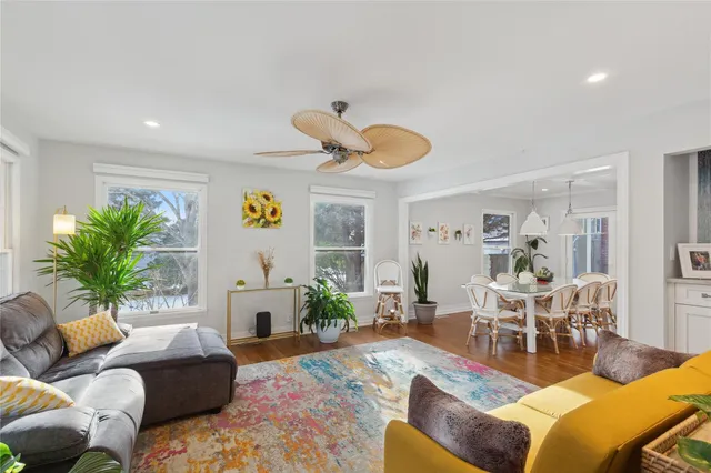 a living room with furniture flowerpot and a fireplace