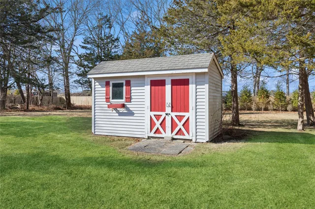 a view of a chairs and table in the patio