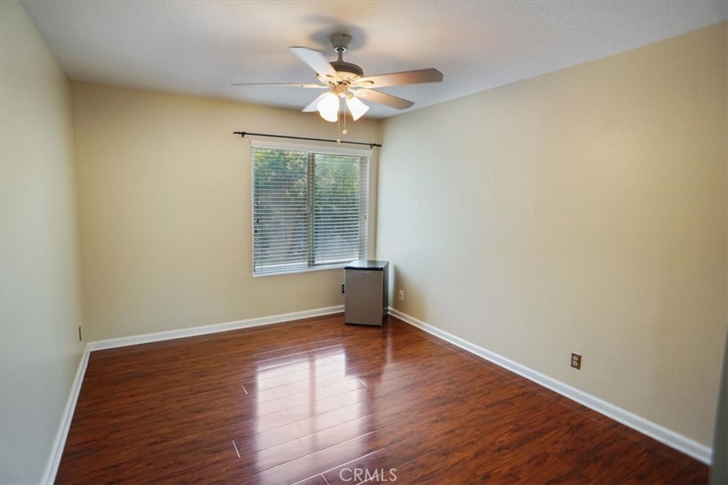 5530 Buffwood Place Agoura Hills, CA 91301 - Photo 17 of 22 an empty room with wooden floor and windows