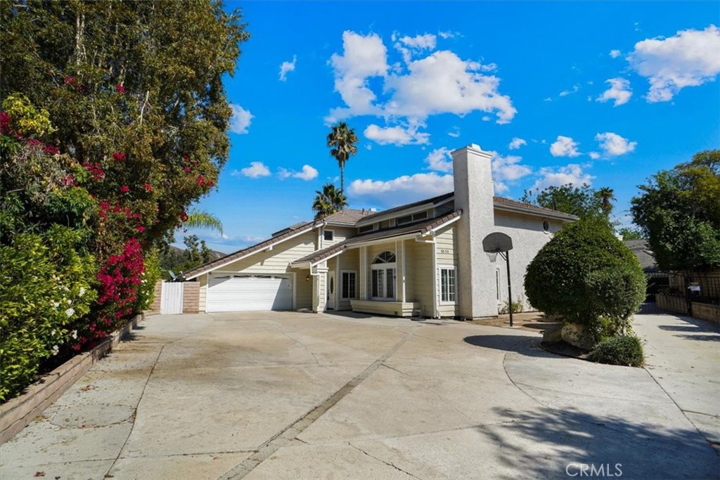5530 Buffwood Place Agoura Hills, CA 91301 - Photo 2 of 22 a view of a white house with a yard