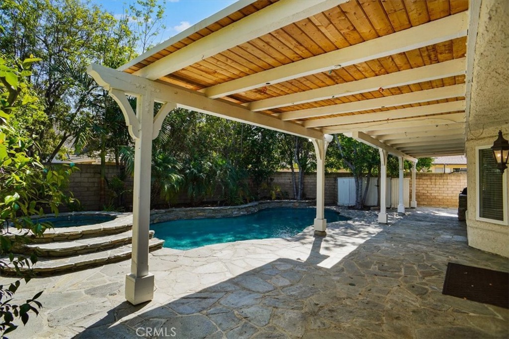 5530 Buffwood Place Agoura Hills, CA 91301 - Photo 3 of 22 a view of a patio with table and chairs with wooden floor and fence