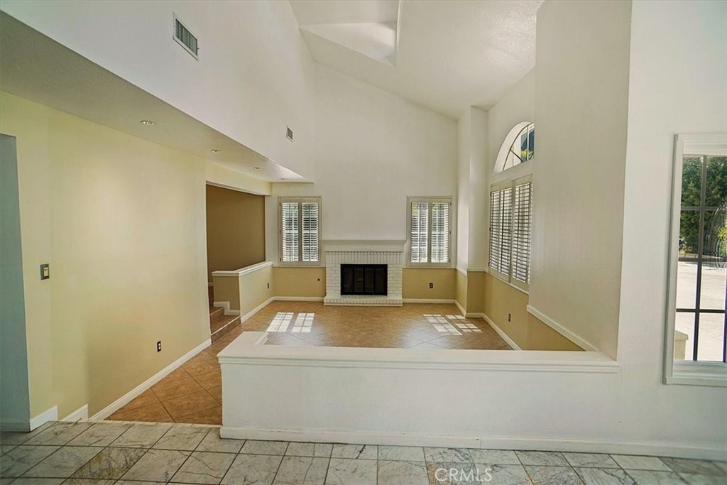 5530 Buffwood Place Agoura Hills, CA 91301 - Photo 4 of 22 a view of a livingroom with a fireplace and window