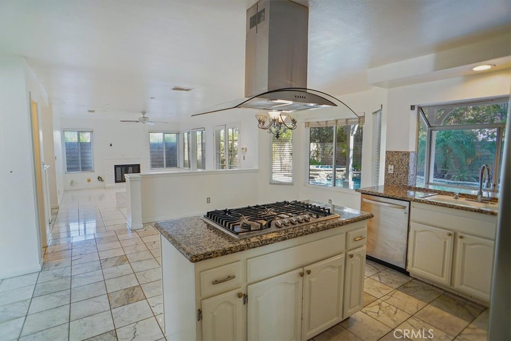 5530 Buffwood Place Agoura Hills, CA 91301 - Photo 6 of 22 a kitchen with stainless steel appliances granite countertop a sink stove and cabinets