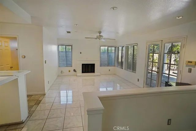 a view of livingroom with furniture and ceiling fan