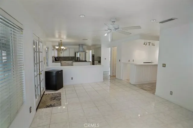 a view of a kitchen with refrigerator and microwave