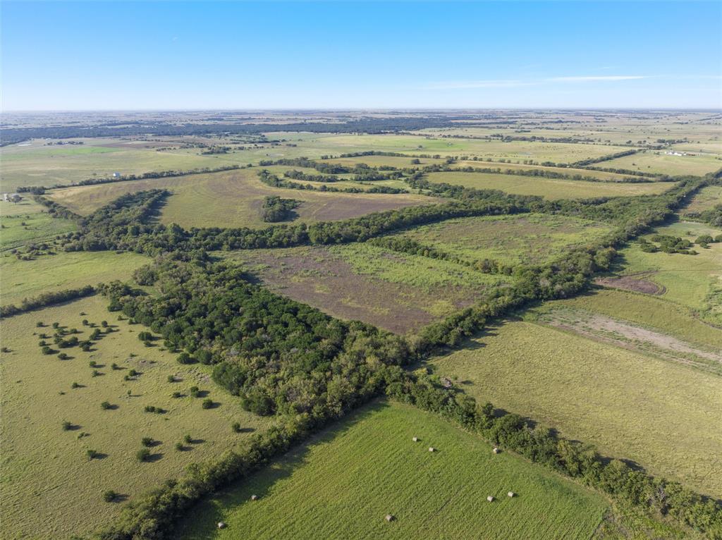 902 Mattlage Road Crawford, TX 76638 - Photo 14 of 30 Aerial view of property and surrounding area featuring rural landscape
