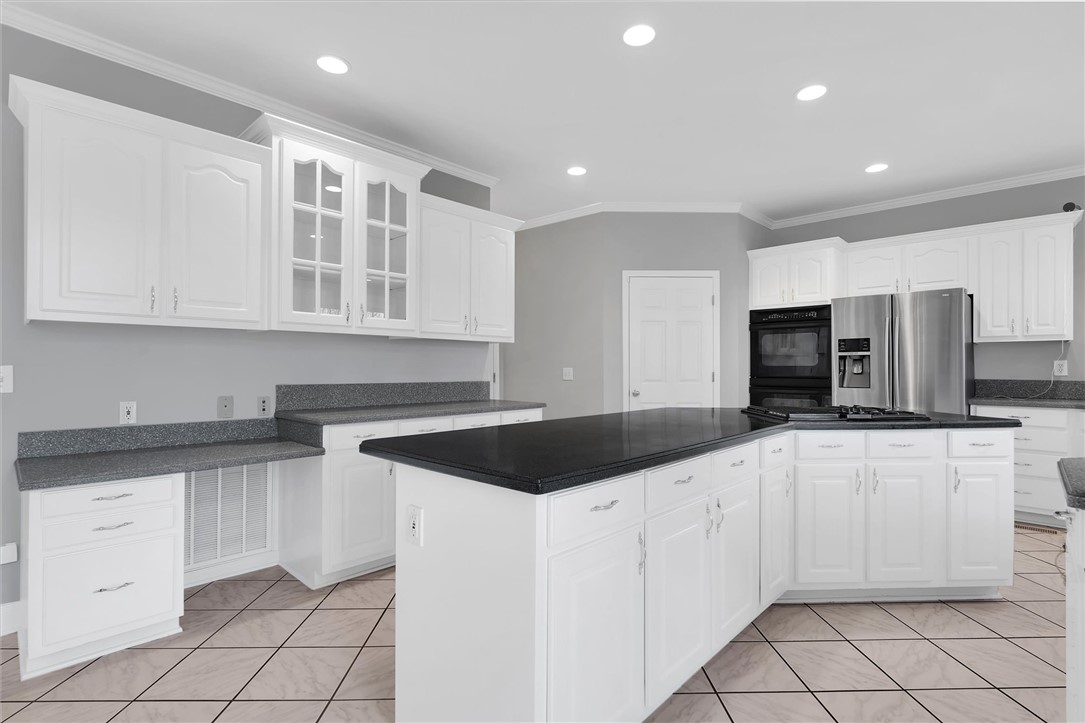 204 Red Maple Way Clemson, SC 29631 - Photo 16 of 48 This spacious kitchen offers ample cabinetry, extensive counter space, and modern appliances, perfect for everyday living.