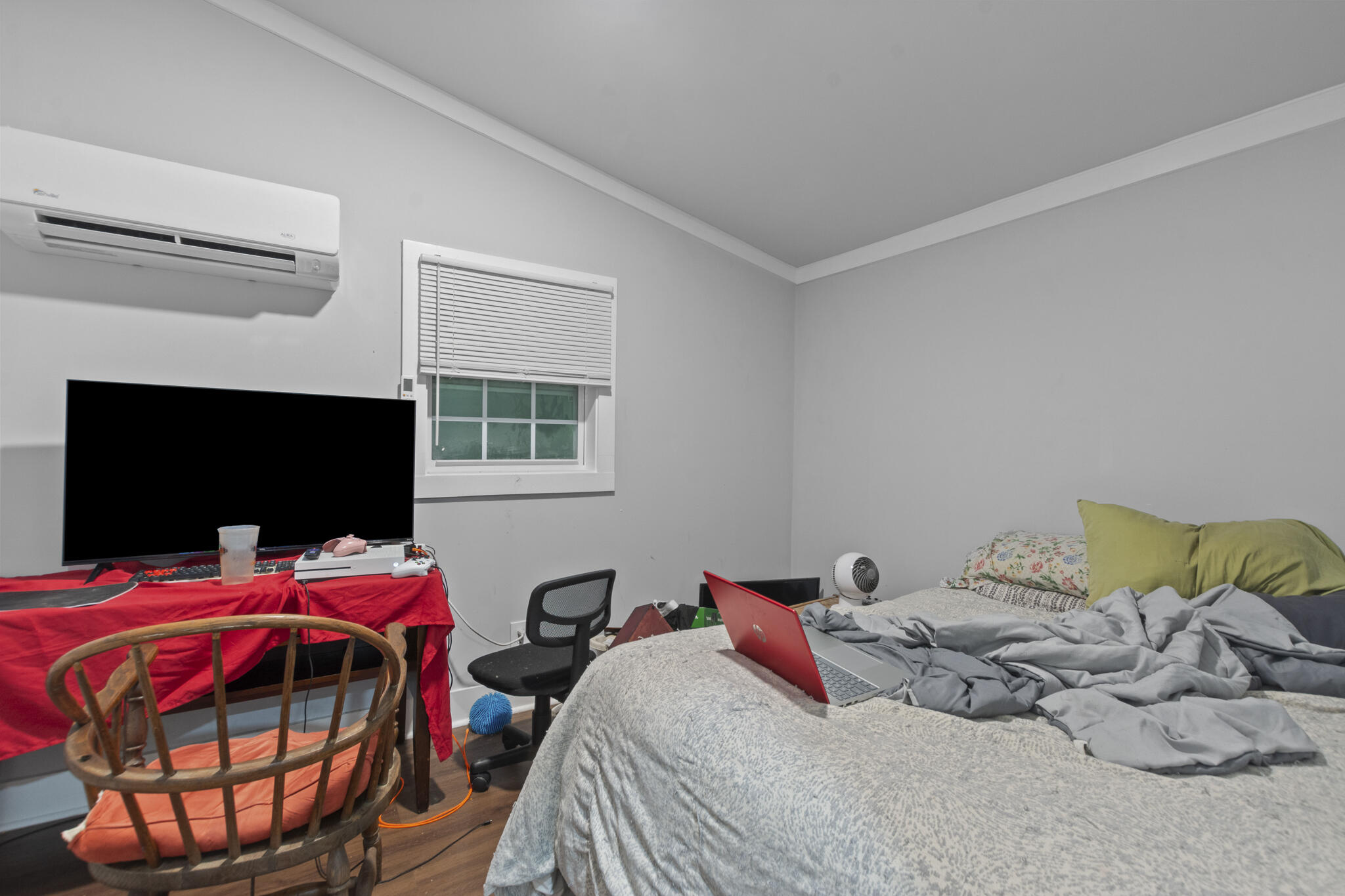 74 West Shell Cracker Road Freeport, FL 32439 - Photo 11 of 40 a bedroom with a bed and a flat screen tv