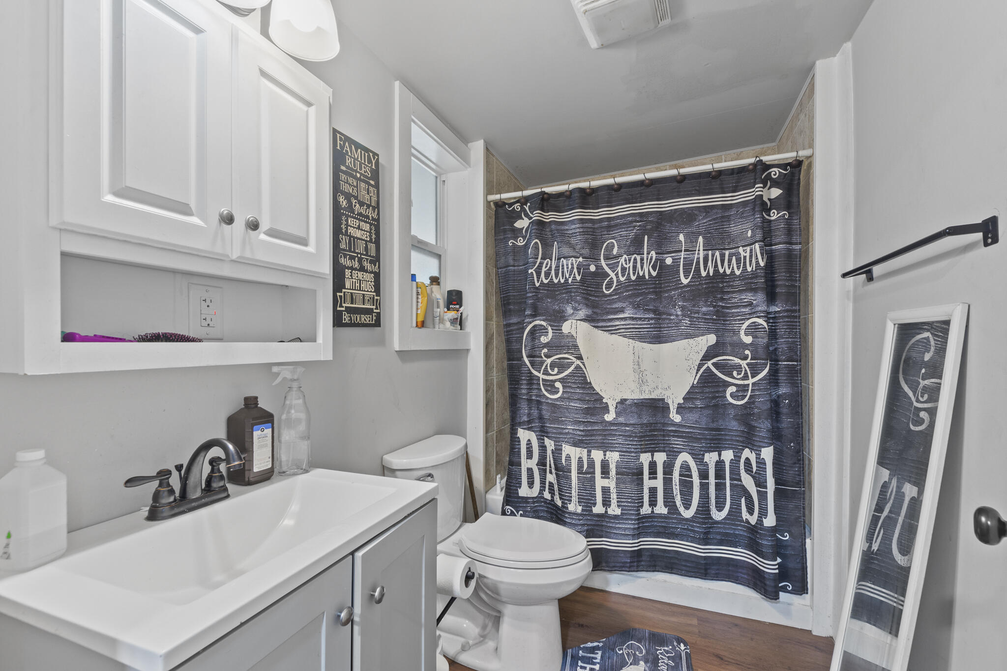 74 West Shell Cracker Road Freeport, FL 32439 - Photo 14 of 40 a bathroom with a sink toilet and shower