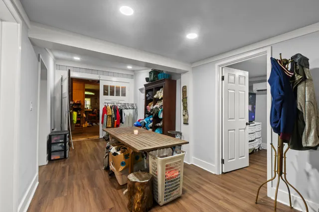 a living room with furniture a ceiling fan and a window