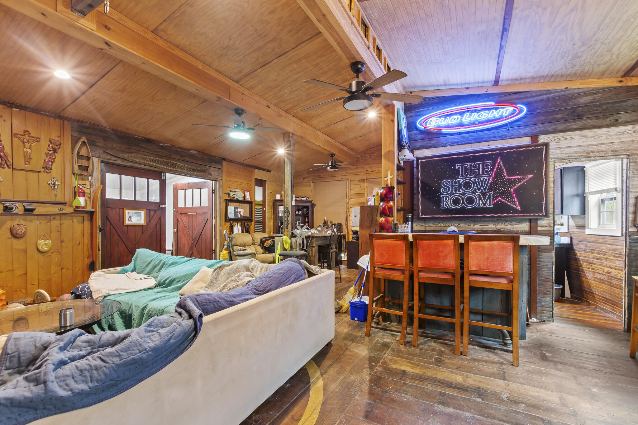 74 West Shell Cracker Road Freeport, FL 32439 - Photo 16 of 40 a living room with furniture a ceiling fan and a window