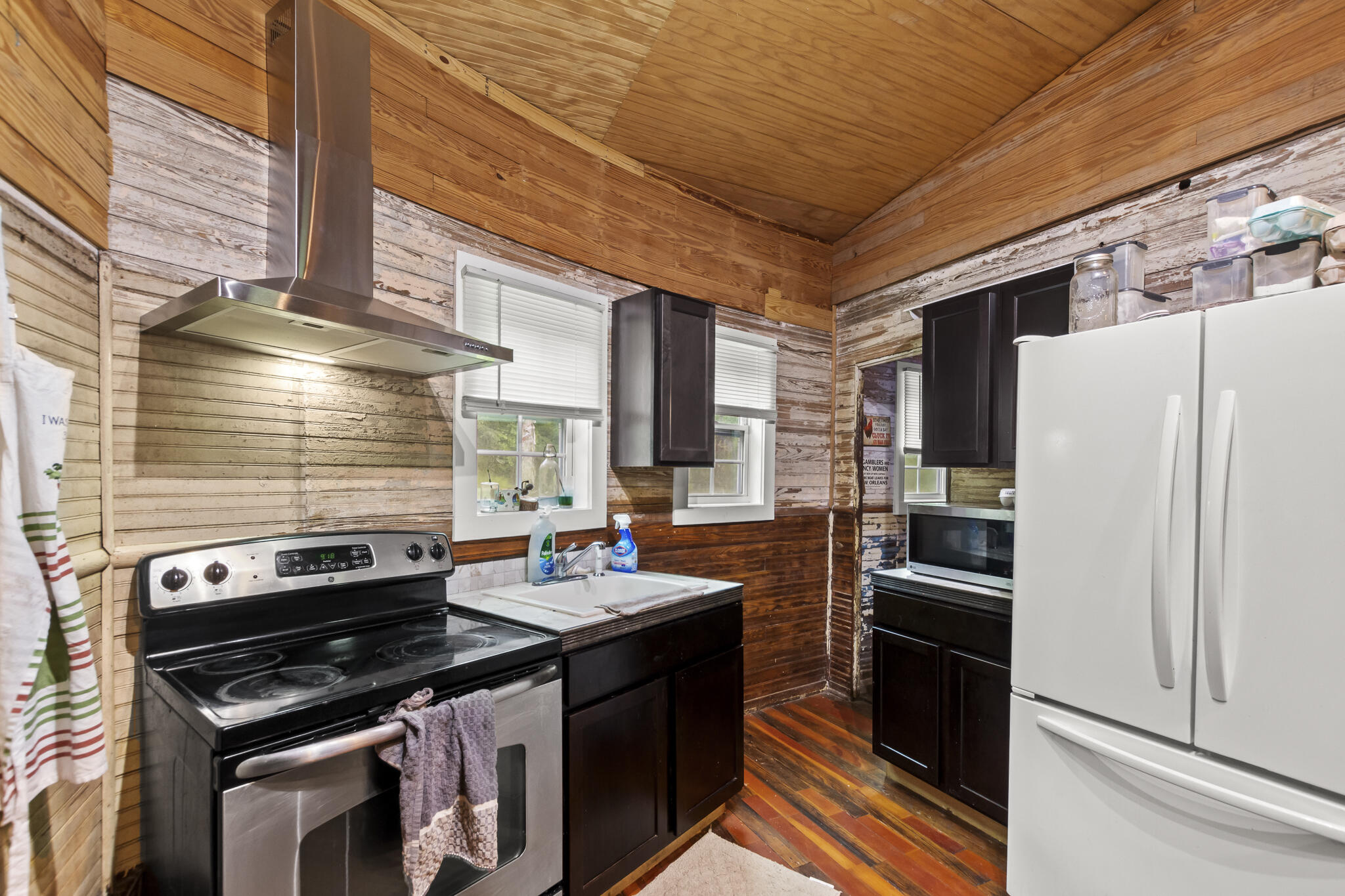 74 West Shell Cracker Road Freeport, FL 32439 - Photo 18 of 40 a kitchen with a stove and a refrigerator