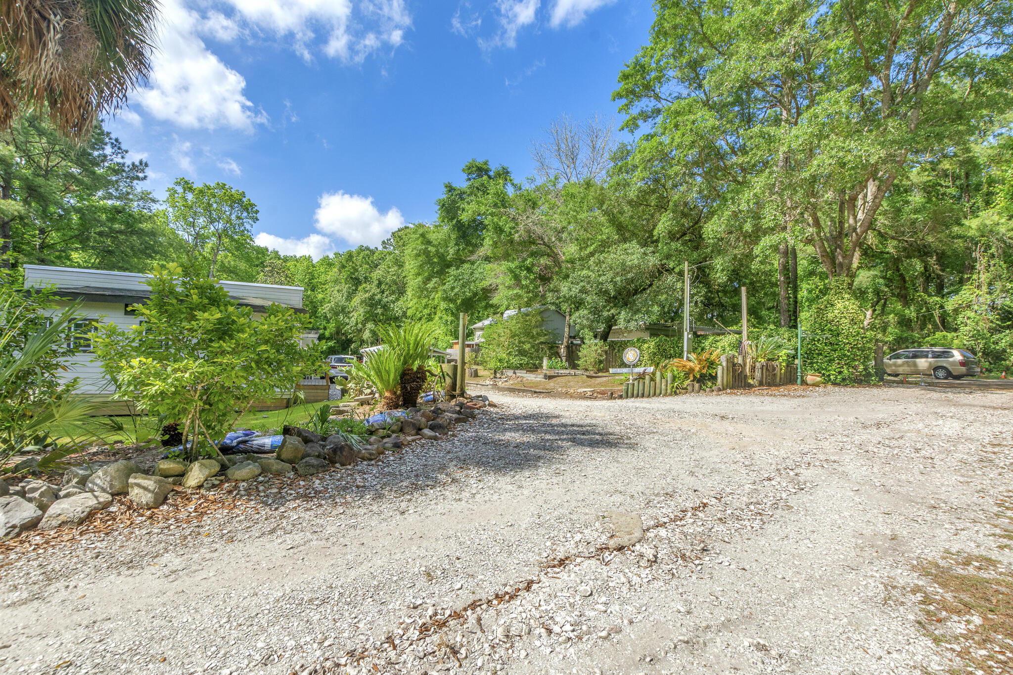 74 West Shell Cracker Road Freeport, FL 32439 - Photo 2 of 40 a view of a yard with plants and trees