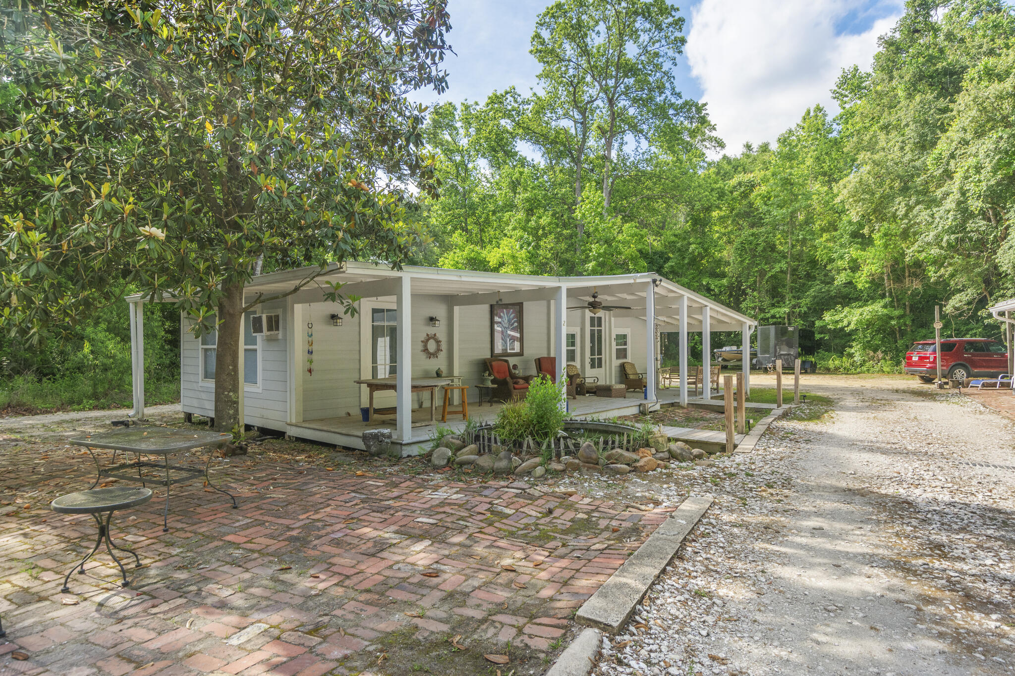 74 West Shell Cracker Road Freeport, FL 32439 - Photo 22 of 40 a view of a house with a yard