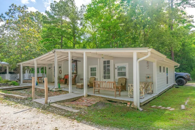 a balcony with furniture and wooden floor