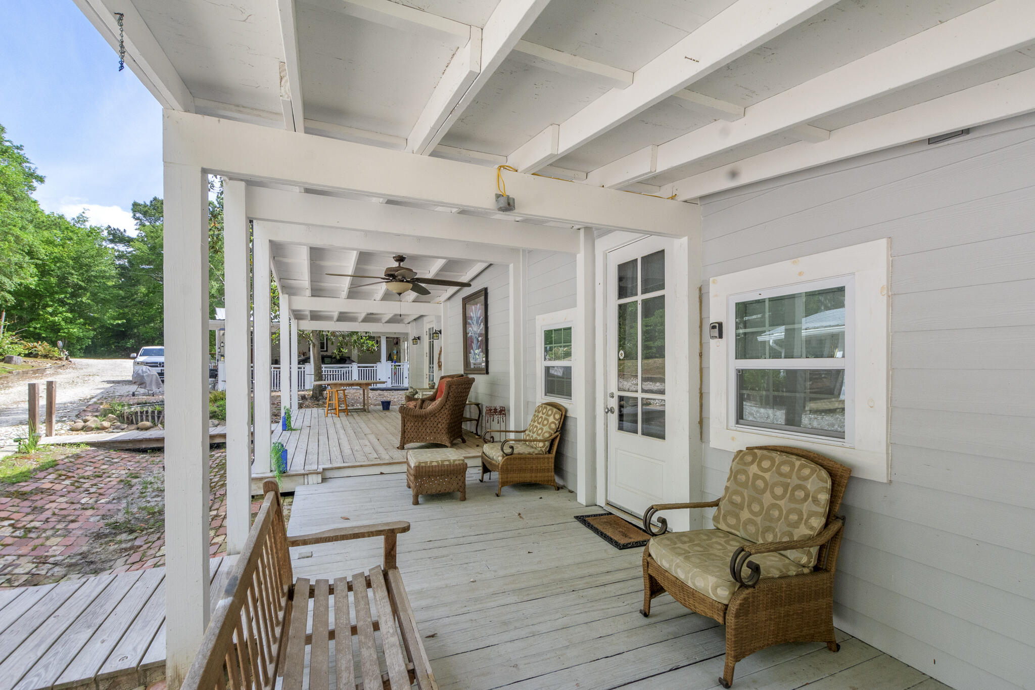 74 West Shell Cracker Road Freeport, FL 32439 - Photo 24 of 40 a balcony with furniture and wooden floor