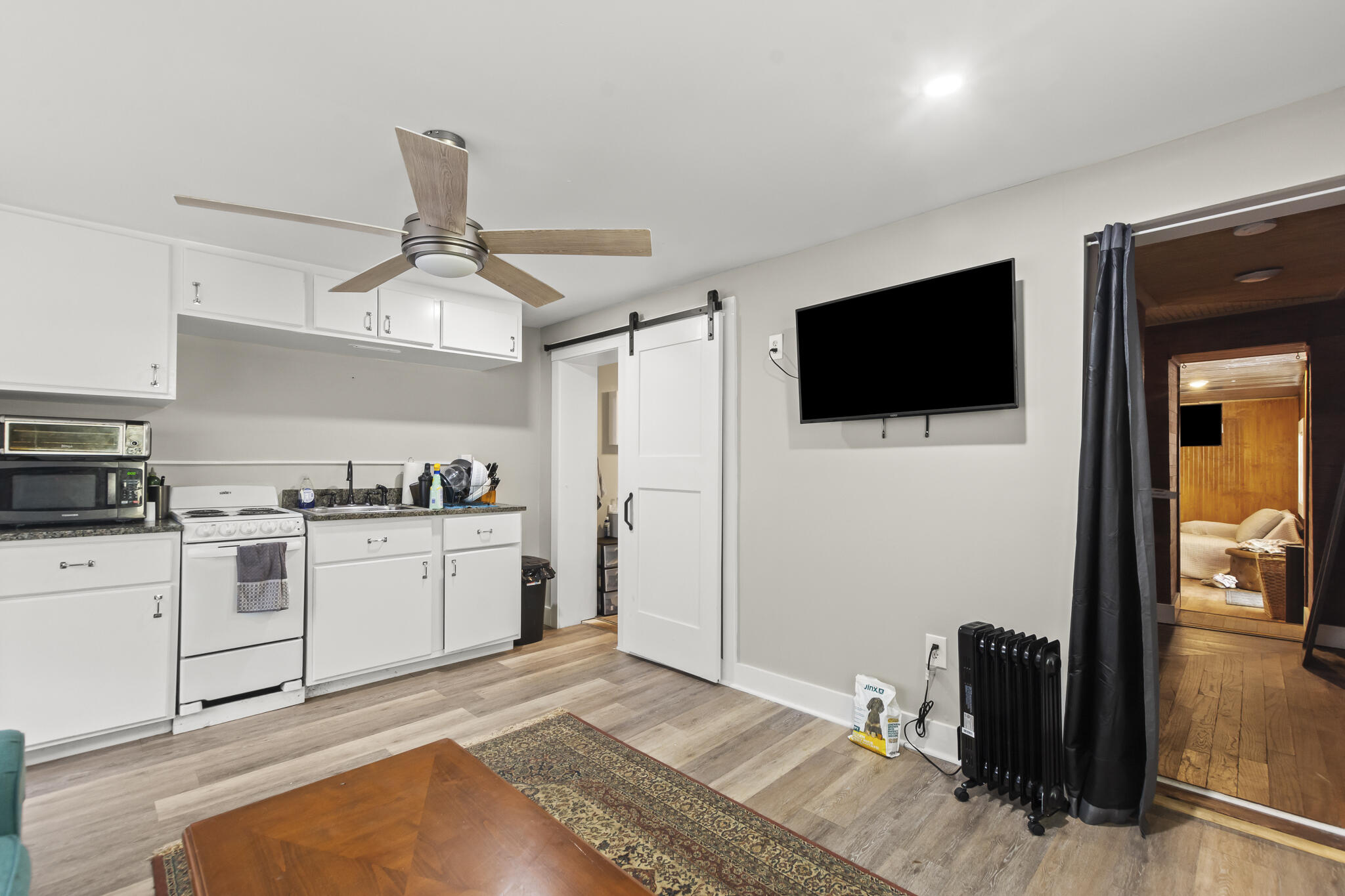 74 West Shell Cracker Road Freeport, FL 32439 - Photo 25 of 40 a bedroom with a bed and a flat screen tv