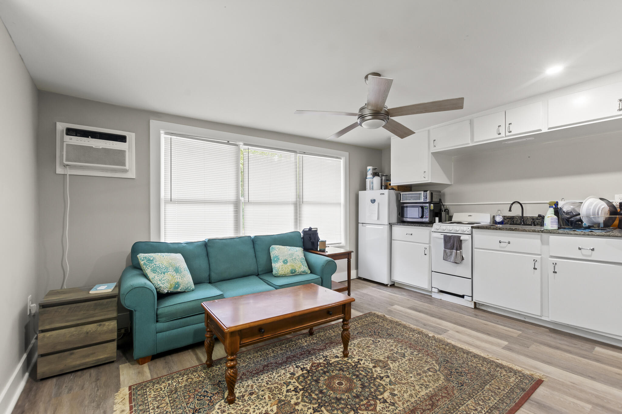 74 West Shell Cracker Road Freeport, FL 32439 - Photo 26 of 40 a living room with furniture and kitchen view