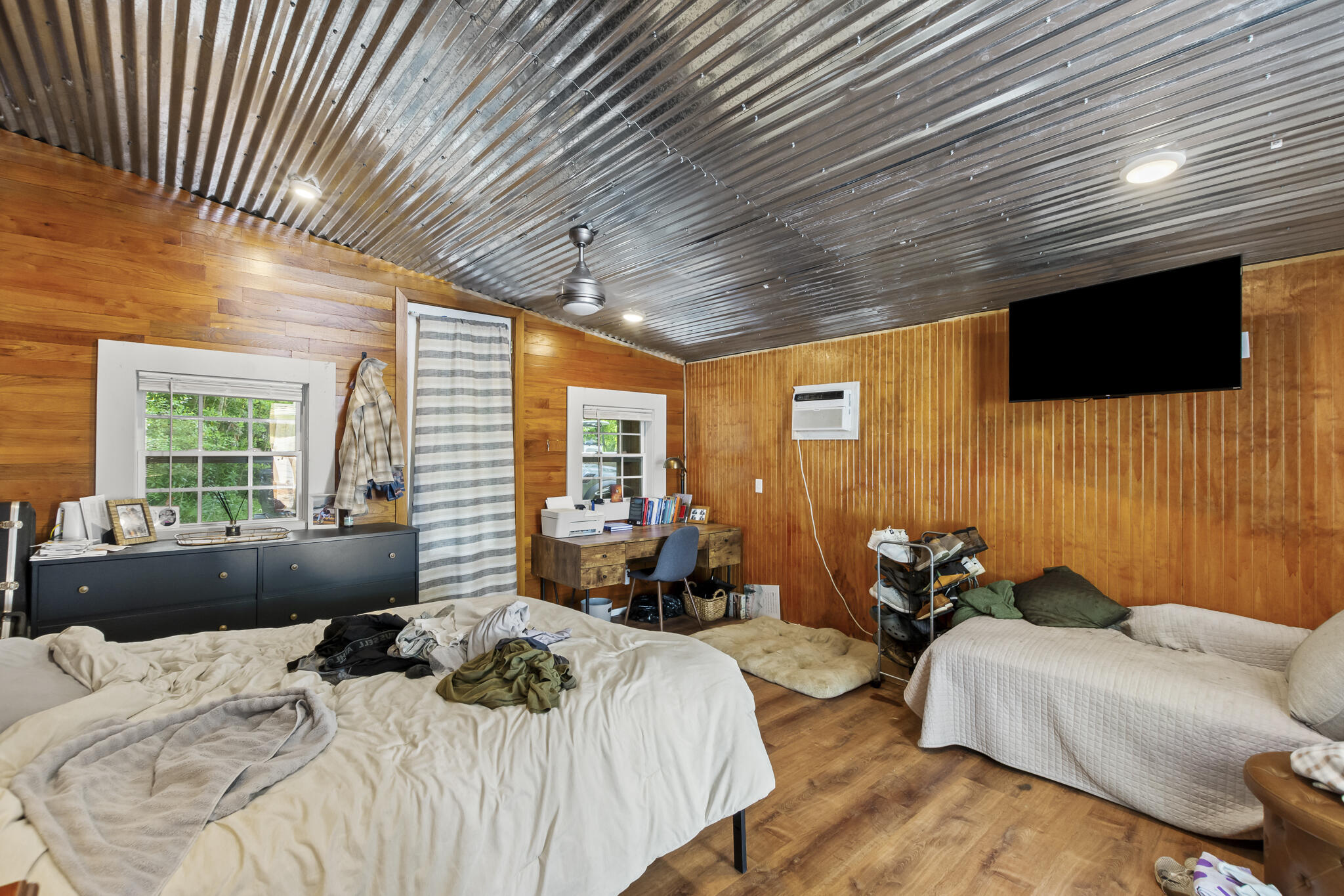 74 West Shell Cracker Road Freeport, FL 32439 - Photo 29 of 40 a bedroom with furniture and a flat screen tv