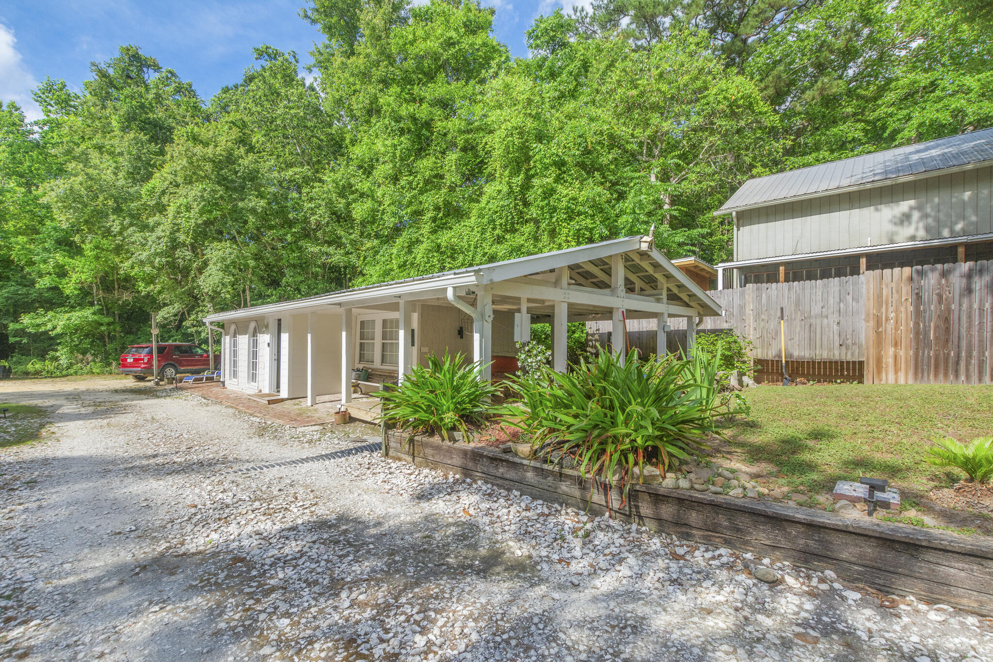 74 West Shell Cracker Road Freeport, FL 32439 - Photo 31 of 40 a front view of a house with garden