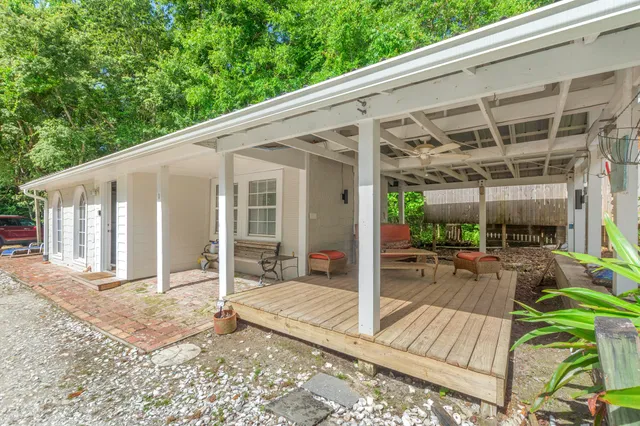 a living room with furniture and flat screen tv
