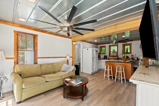 a white toilet sitting next to a bathroom sink