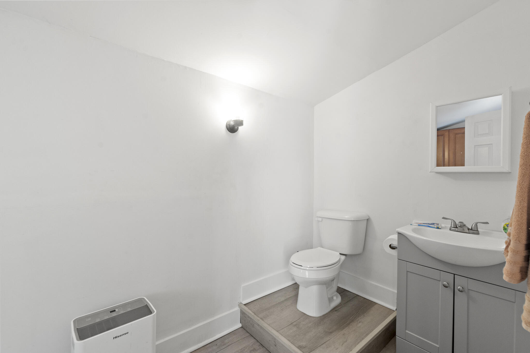 74 West Shell Cracker Road Freeport, FL 32439 - Photo 35 of 40 a white toilet sitting next to a bathroom sink