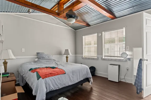 a white toilet sitting next to a bathroom sink and vanity