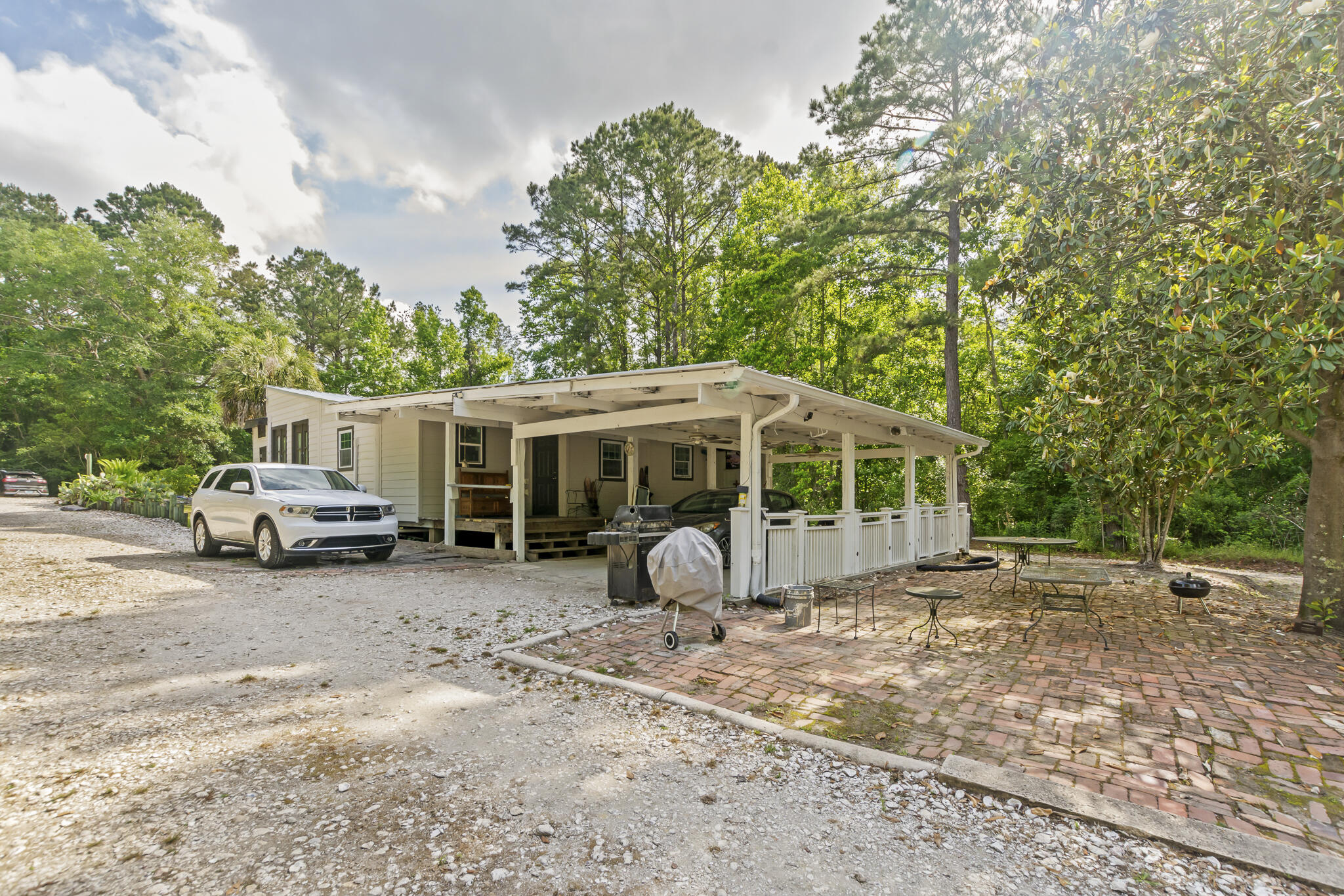 74 West Shell Cracker Road Freeport, FL 32439 - Photo 7 of 40 a view of a house with backyard space and sitting area