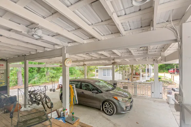 a living room filled with furniture and a wooden floor