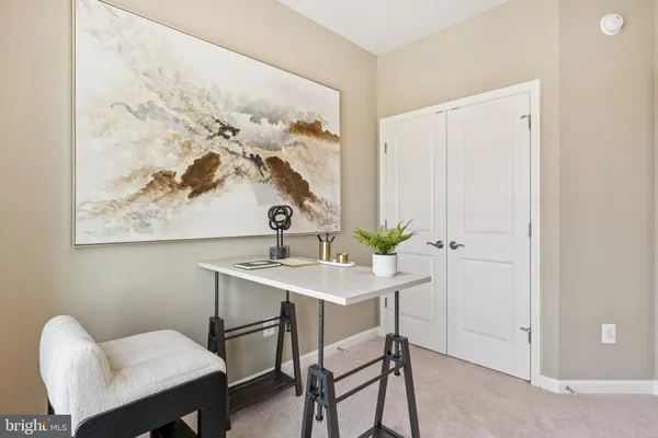 a view of a workspace with furniture