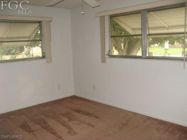 207 Davis Road Lehigh Acres, FL 33936 - Photo 6 of 10 an empty room with a window