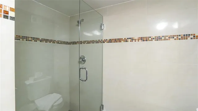 a bathroom with a shower and a shower
