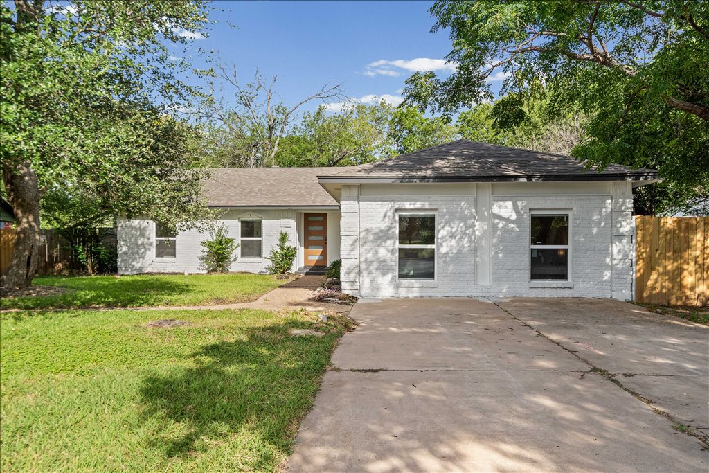 1406 North Georgetown Street Round Rock, TX 78664 - Photo 1 of 34 A whitewashed brick exterior with a modern wood entry door provides charming curb appeal.