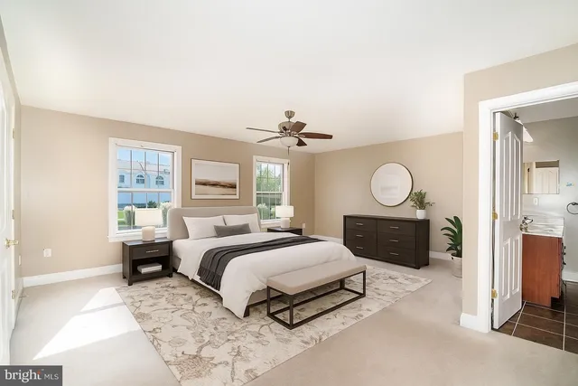 a bedroom with a bed large window with wooden floor