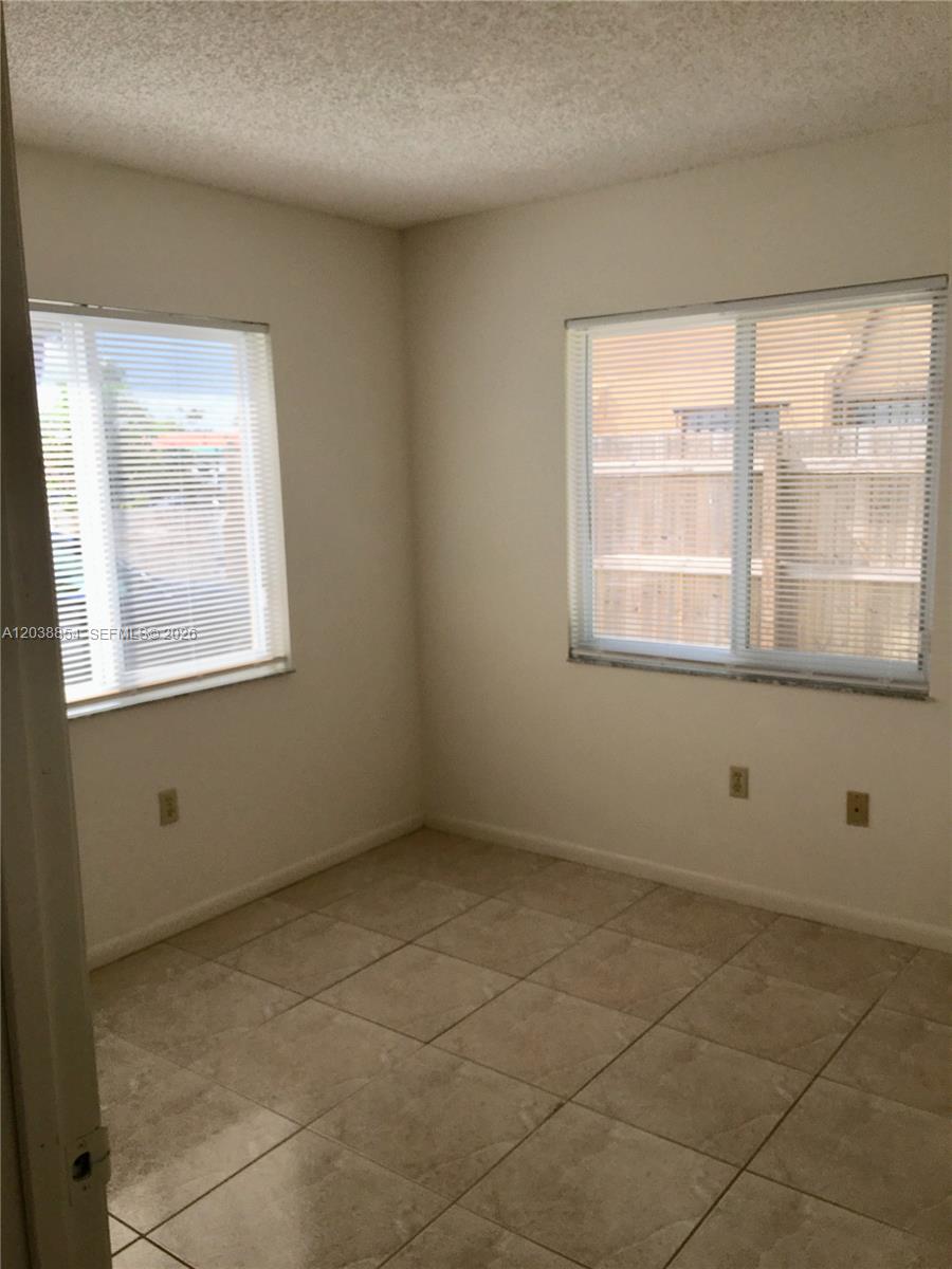 1419 Southwest 22nd Avenue Miami, FL 33145 - Photo 17 of 20 an empty room with a window
