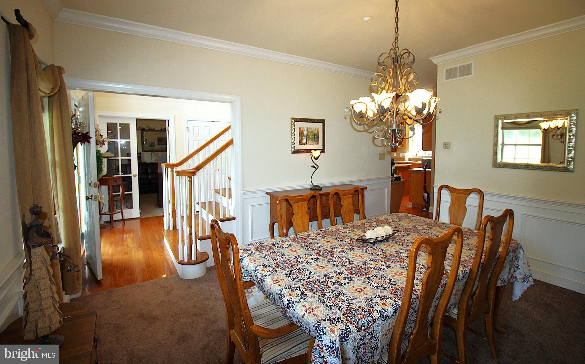 193 Curley Mill Road Chalfont, PA 18914 - Photo 12 of 49 a view of a dining room with furniture and chandelier