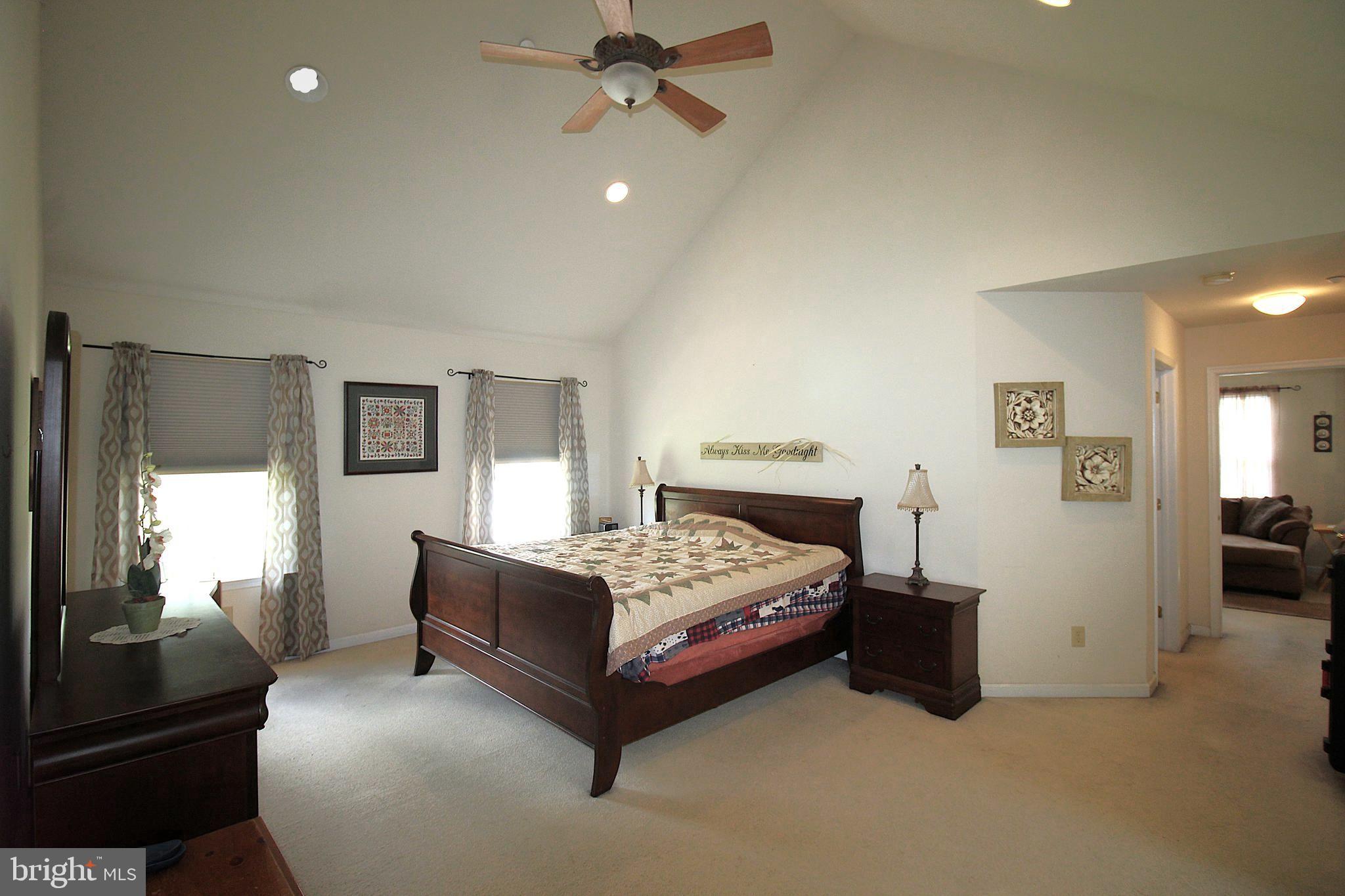 193 Curley Mill Road Chalfont, PA 18914 - Photo 23 of 49 a bedroom with a bed and a chandelier