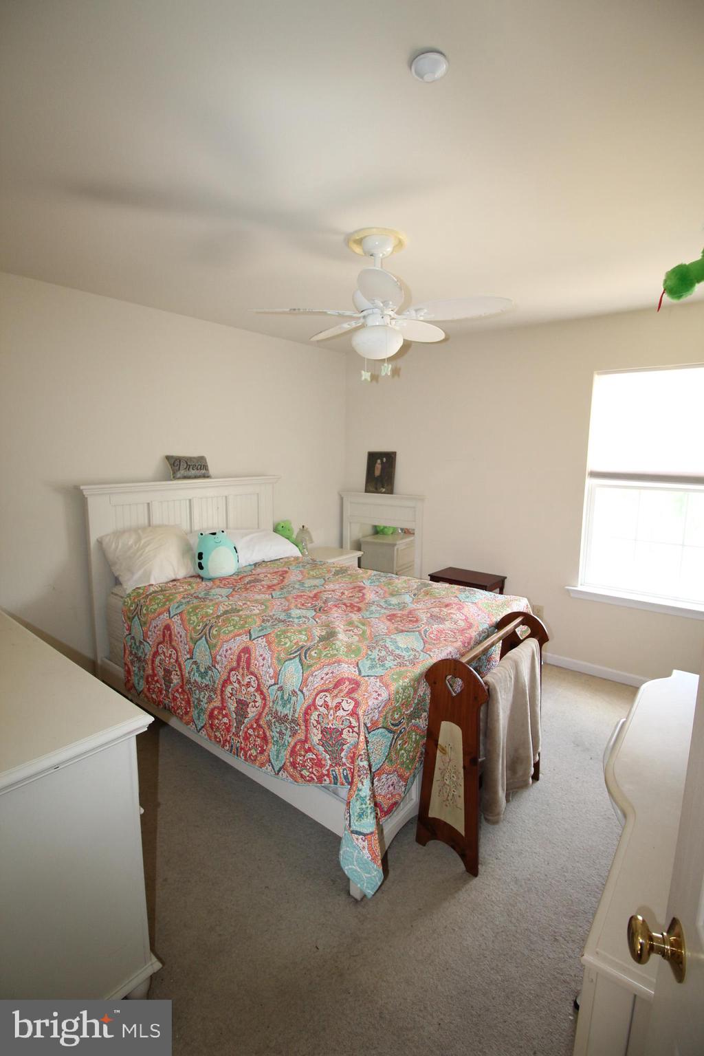 193 Curley Mill Road Chalfont, PA 18914 - Photo 29 of 49 a bedroom with a bed and a chandelier