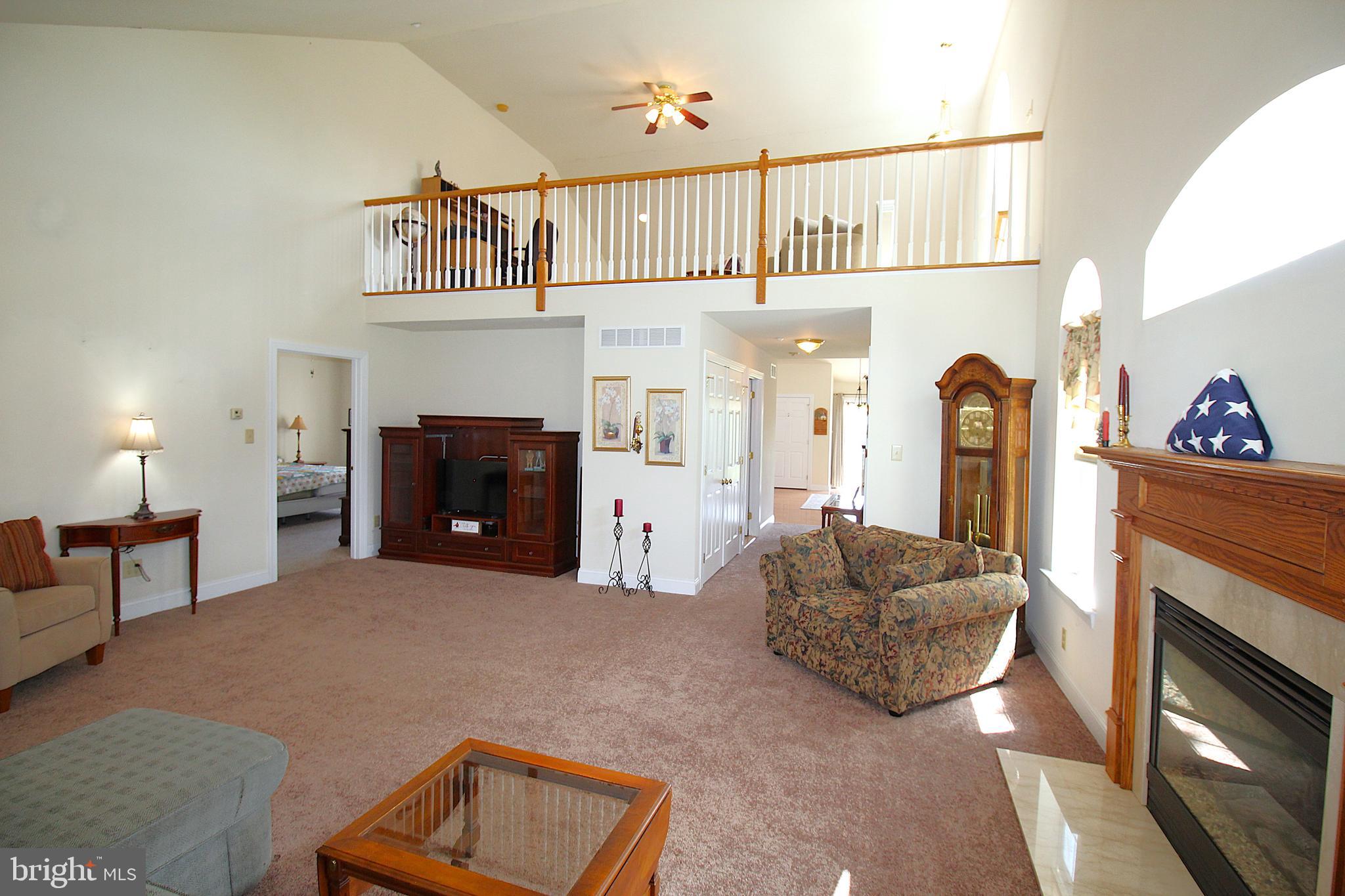 193 Curley Mill Road Chalfont, PA 18914 - Photo 34 of 49 a living room with furniture a fireplace and a window