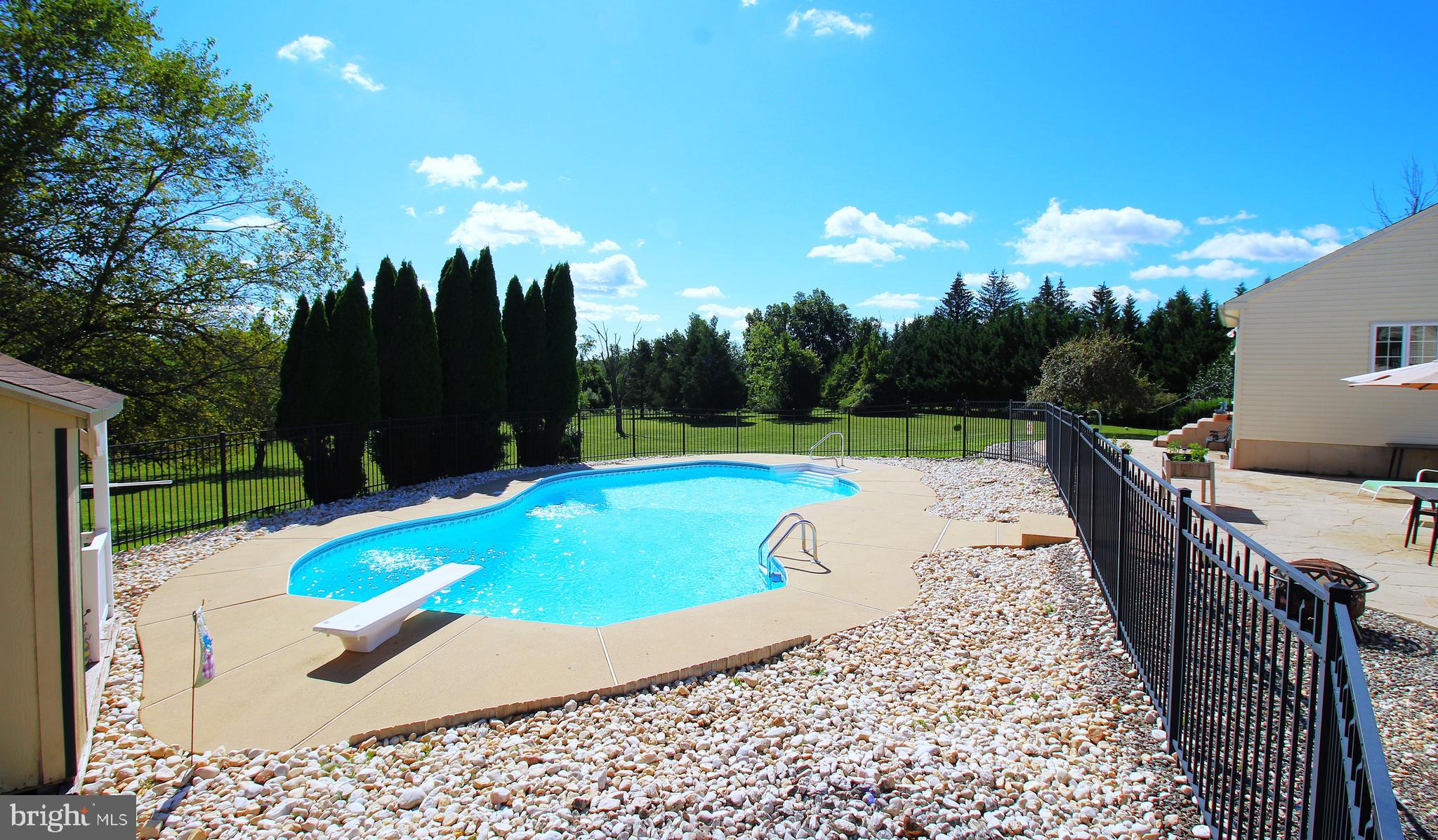 193 Curley Mill Road Chalfont, PA 18914 - Photo 48 of 49 a view of a swimming pool with a patio and a garden