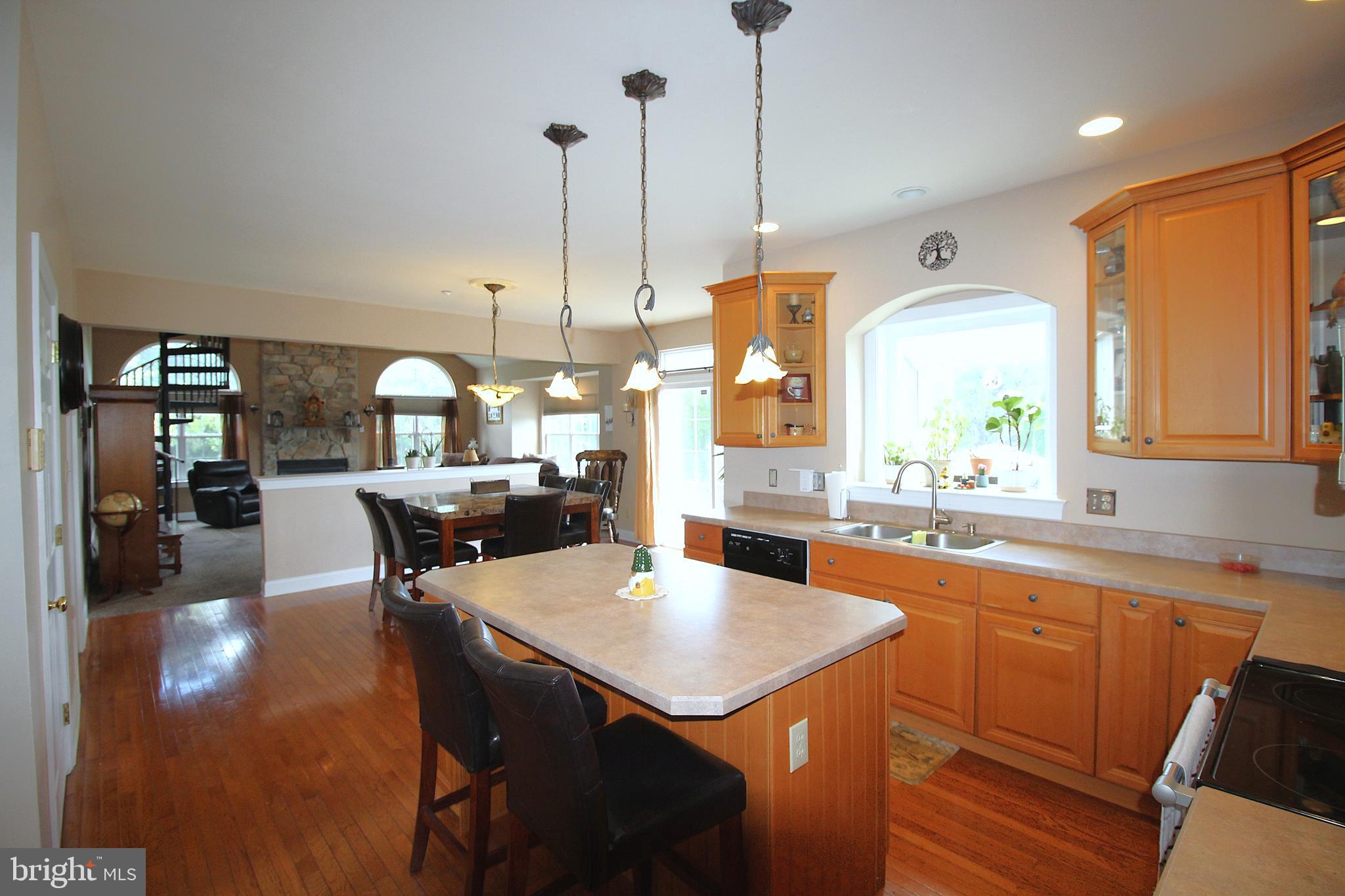 193 Curley Mill Road Chalfont, PA 18914 - Photo 8 of 49 a kitchen with a table chairs and white cabinets