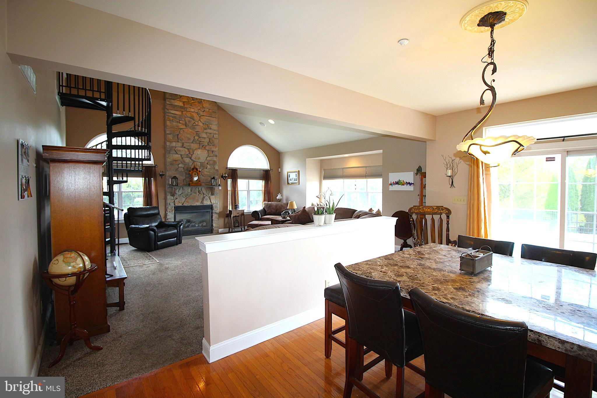 193 Curley Mill Road Chalfont, PA 18914 - Photo 9 of 49 a kitchen with a table chairs refrigerator and stove